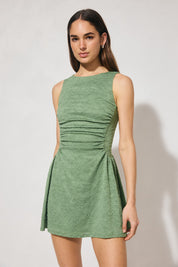 Sleeveless textured lace mini dress with fit-and-flare silhouette, narrow boat neckline, gathered bodice, and full mini-length skirt