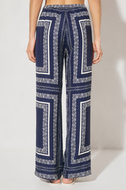 High-waisted tailored woven pants with handcrafted print, straight-leg silhouette, narrow waistband, and side seam pockets