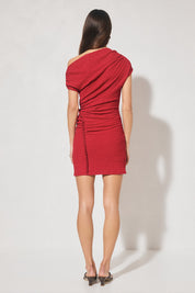 One-shoulder textured jersey mini dress with skimming fit, multi-wear draped neckline, gathered capped sleeve, cascading gathers, contrast frill hip panel, and figure-hugging mini skirt