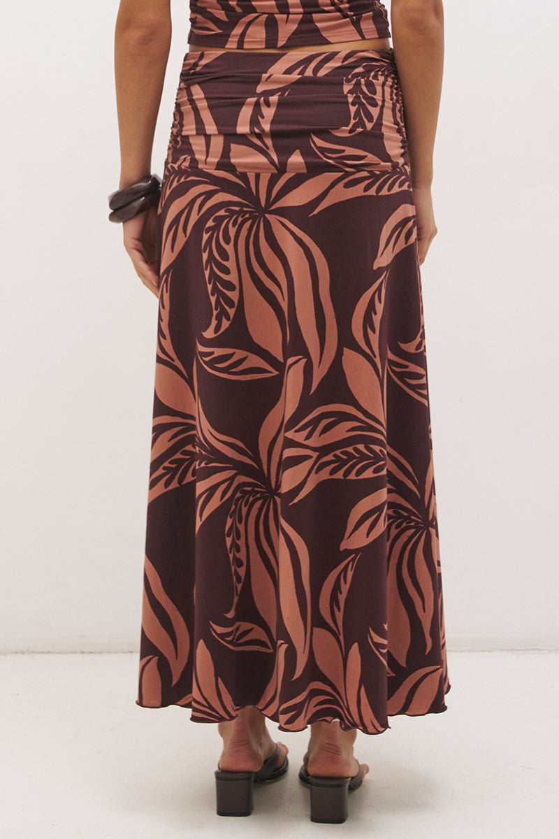 Printed asymmetrical midi skirt with gathered waistband, draped hi-lo hem, and front split in stretch modal jersey