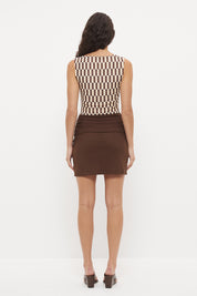 Bodycon mini dress with printed bodice, contrast sarong skirt and macrame tassel tie
