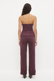 Strapless stretch denim top with tailored bodice, princess seams and contrast buckle belt
