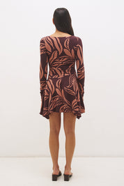 Printed handkerchief hem mini dress with boat neckline, ruched long sleeves, gathered bodice, and hi-lo draped skirt in stretch modal jersey