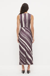 Sleeveless midi dress with fitted column silhouette, twisted knot detail and cascading ruching in exclusive handcrafted print
