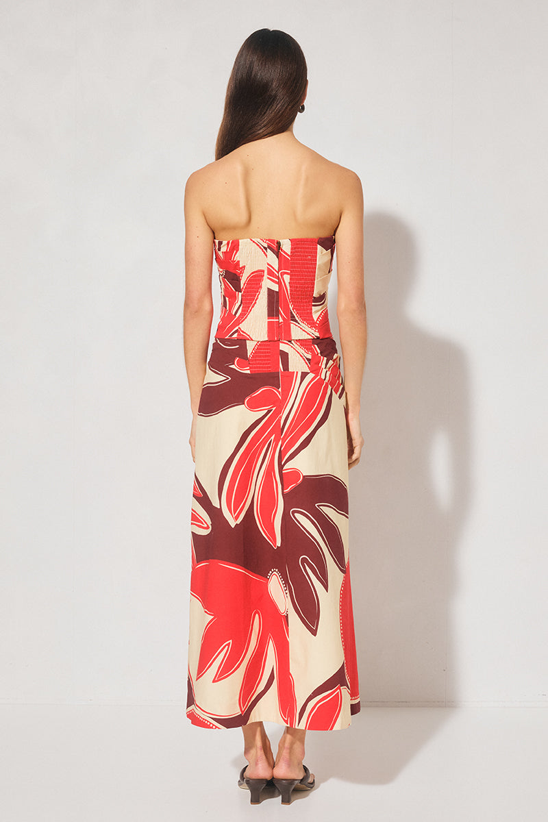 Strapless cotton blend bustier top with straight neckline, angled torso tucks, encased boning, elasticated back panels, and open-ended zipper. 