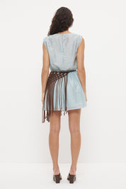 Sleeveless mini dress in sheer woven fabric with blouson bodice and tasseled scarf belt