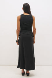 Woman wearing a sleeveless maxi dress with a textured lace bodice overlay, sunray ruching, boat neckline, and a contrast smooth A-line modal skirt in a fit-and-flare silhouette.