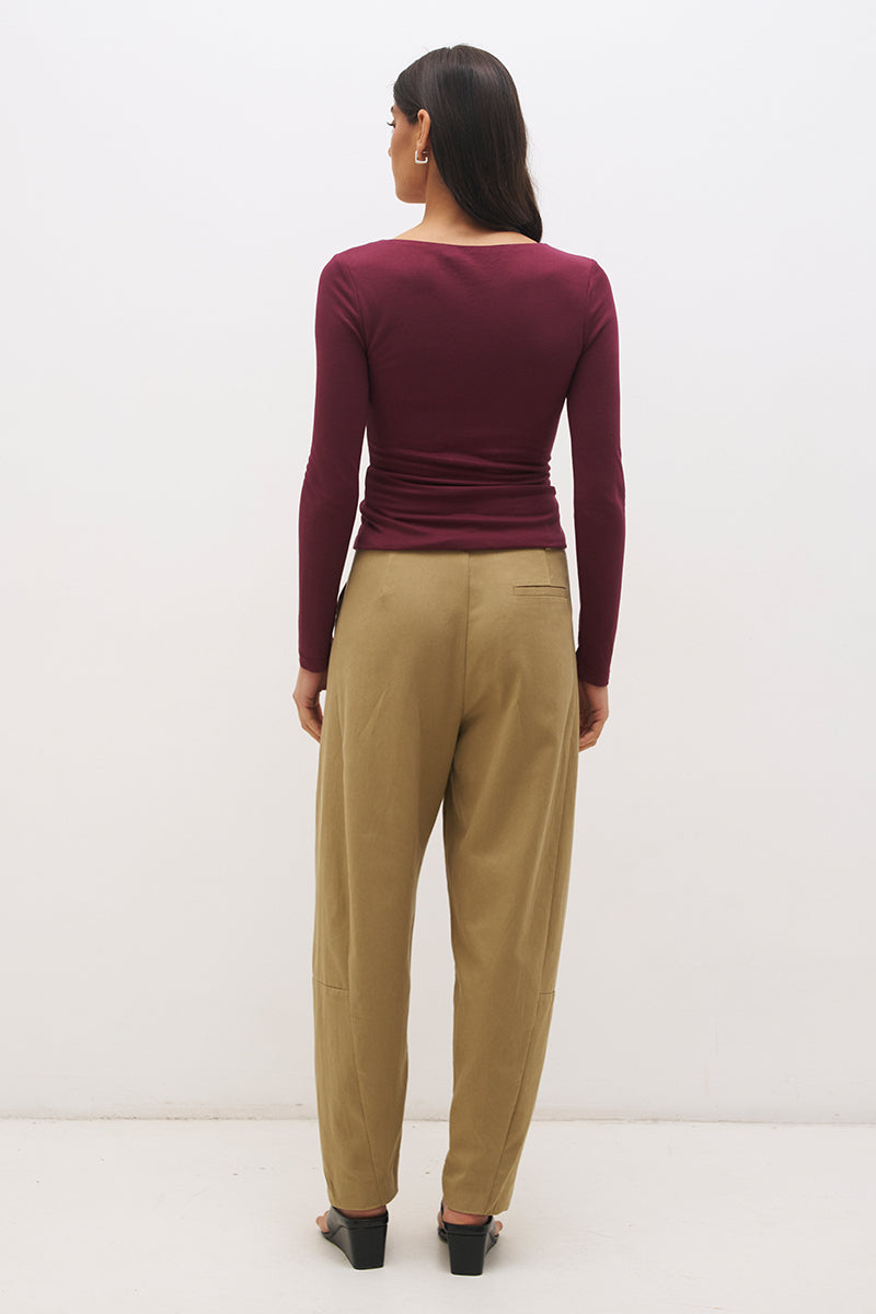 Long sleeve jersey top with plunging V neckline, spiral ring detail and ruched front in a skimming fit