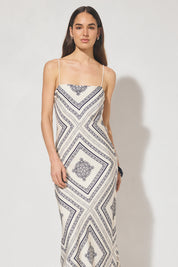 Bias cut maxi slip dress with handcrafted placement print, straight neckline, handkerchief front panel, and adjustable multiwear straps