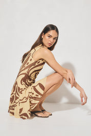 Sleeveless mesh mini dress with handcrafted print, boat neckline, fit and flare silhouette, and hi-lo hem