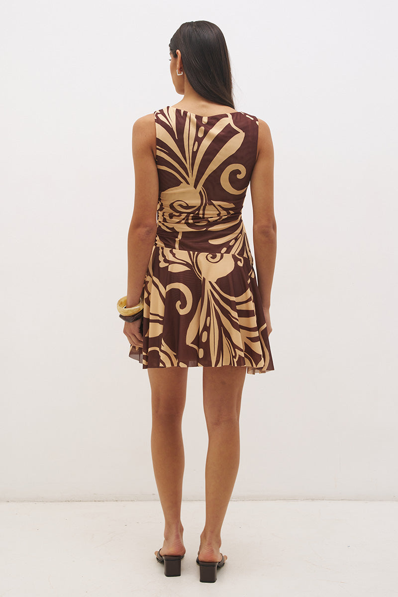 Sleeveless mesh mini dress with handcrafted print, boat neckline, fit and flare silhouette, and hi-lo hem