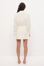 Mini shirt dress in linen seersucker with blouson bodice, cinched waist and scalloped lace hem