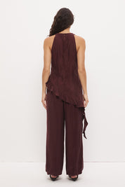 Sleeveless longline top in brushed cupro satin with narrow cowl neckline and asymmetric spiral flounce hem