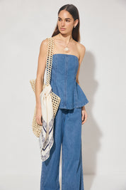 Strapless denim fit-and-flare top with cornelli piping, princess seams, flared circle-cut hem, and centre-back zipper