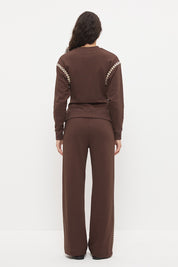 Embroidered fleeced-back sweatshirt with crew neckline, dropped shoulders, waist tucks, and ribbed hem band