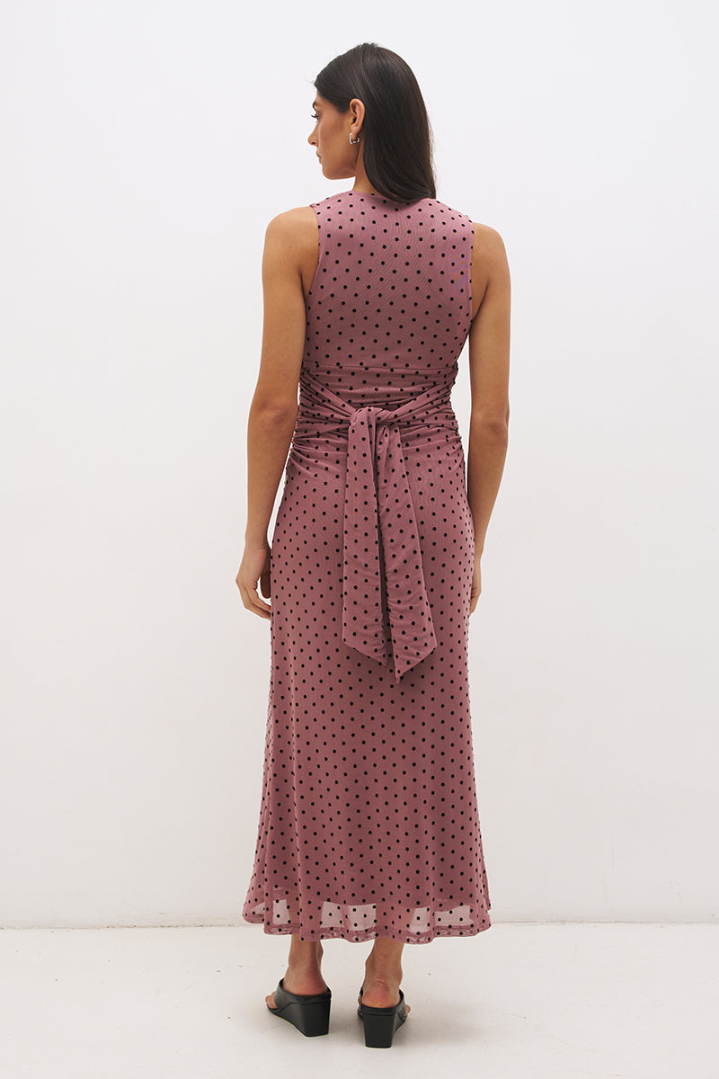 Sleeveless flocked polka dot mesh top with plunging V neckline, empire line seam and ruched fitted silhouette