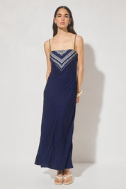 Bias cut maxi slip dress with handcrafted placement print, straight neckline, handkerchief front panel, and adjustable multiwear straps