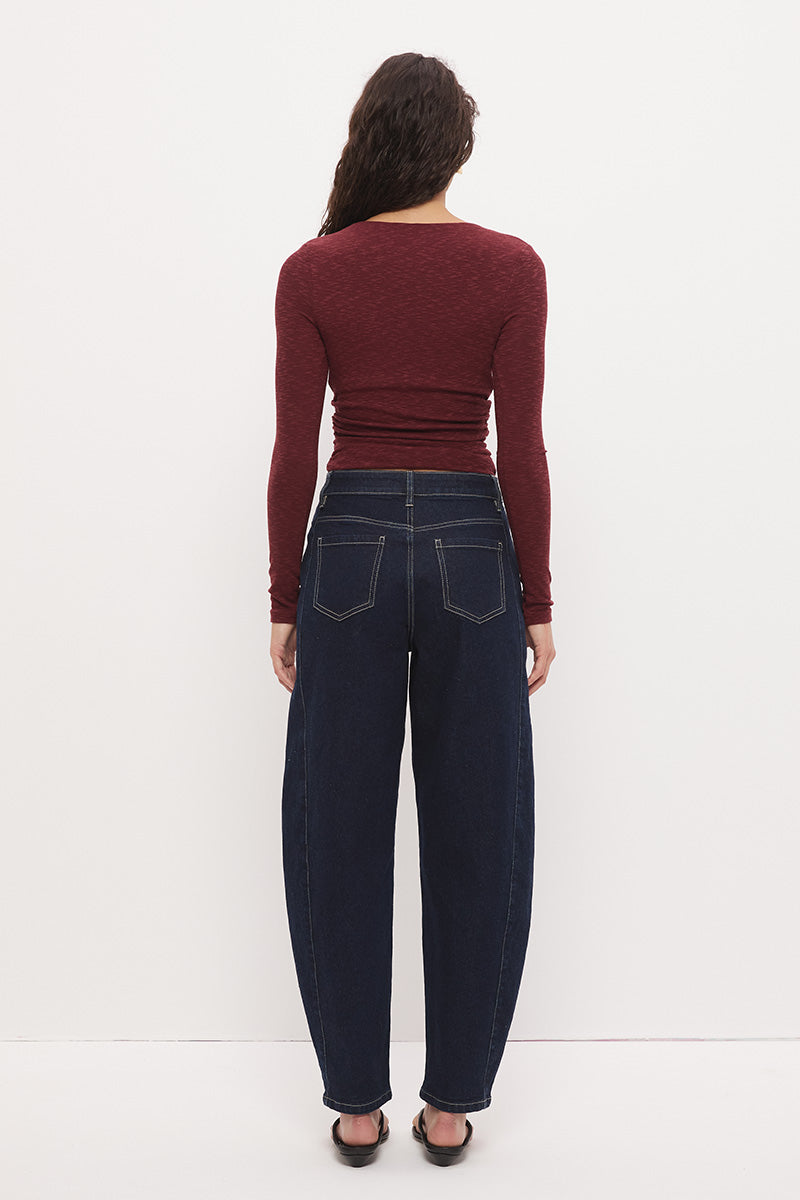Long sleeve textured jersey fitted top with V-neckline, beaded strap detail, empire waist, and soft waist gathering