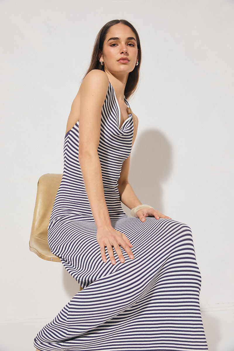 Knitted halter neck dress with asymmetrical cowled neckline, bodycon fit, contrast bead strap detail, and fit-and-flare silhouette